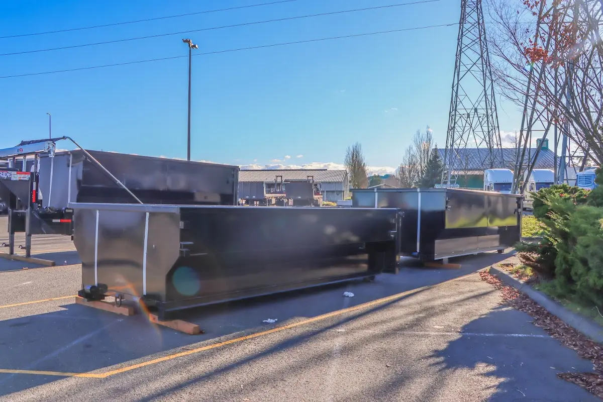 Roll-off dumpster ready for waste disposal at job site for 2 Yard Dumpster Rental in Auburn
